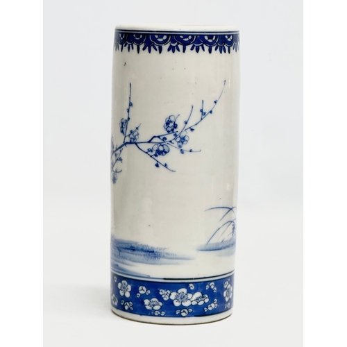 246A - A 19th Century Chinese blue and white cylinder vase. With hand painted sunflowers, trees and prunus ... 