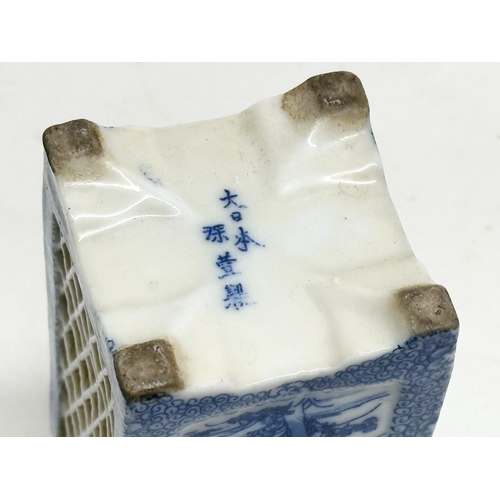 246C - An Early 20th Century Japanese blue and white pierced pottery vase. 11cm