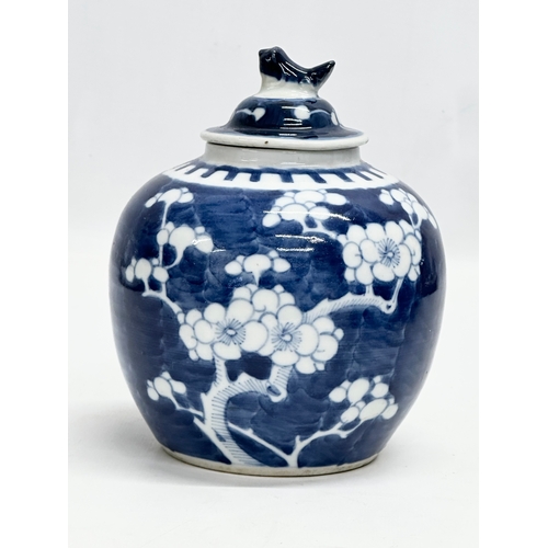 246D - A Late 19th Century Chinese blue and white prunus jar with cover. 12x16cm.