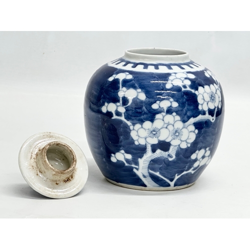 246D - A Late 19th Century Chinese blue and white prunus jar with cover. 12x16cm.