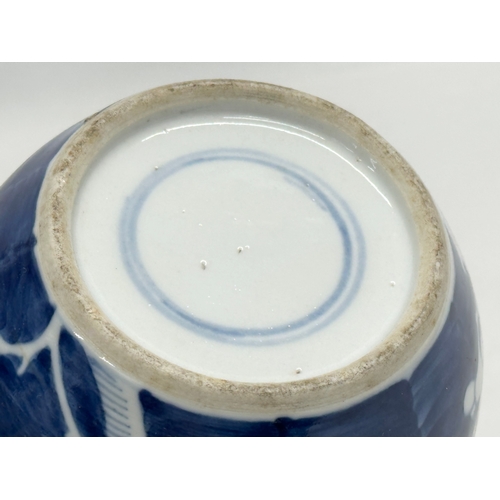 246D - A Late 19th Century Chinese blue and white prunus jar with cover. 12x16cm.