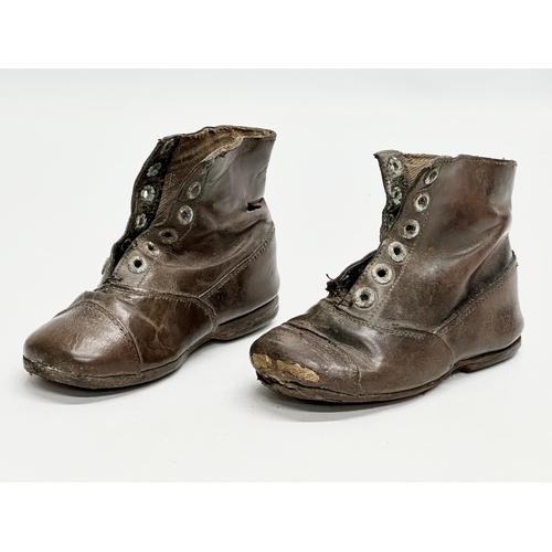 375 - A pair of 19th Century Victorian leather child’s shoes.