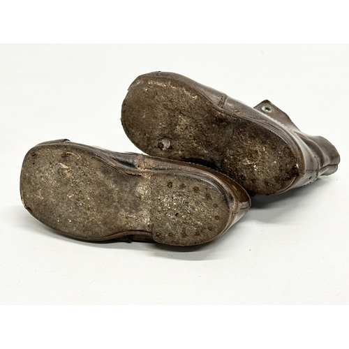 375 - A pair of 19th Century Victorian leather child’s shoes.