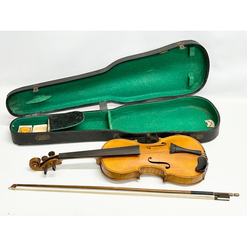 423 - An Early 20th Century violin in case. Wolff Bros.