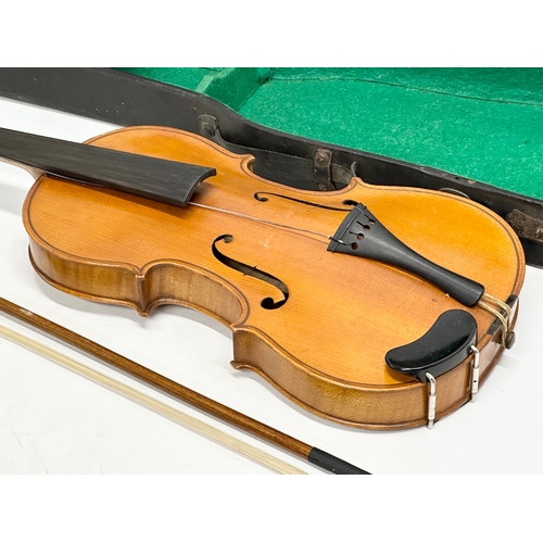 423 - An Early 20th Century violin in case. Wolff Bros.