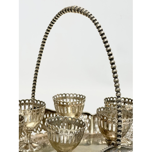 246G - An Early 20th Century silver plated egg cup cruet set/breakfast set. 1918-1923. Tray 29x20cm.