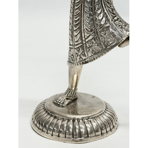 10A - A Late 19th/Early 20th Century Indian silver figure. 23.5cm. 310 grams.