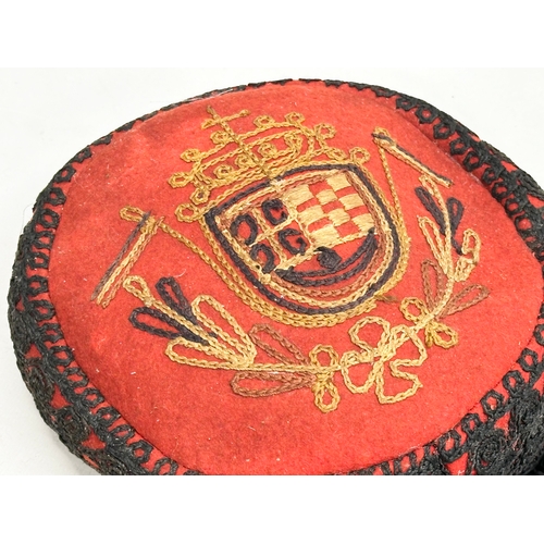 430B - An Early 20th Century Croatian embroidered cap.