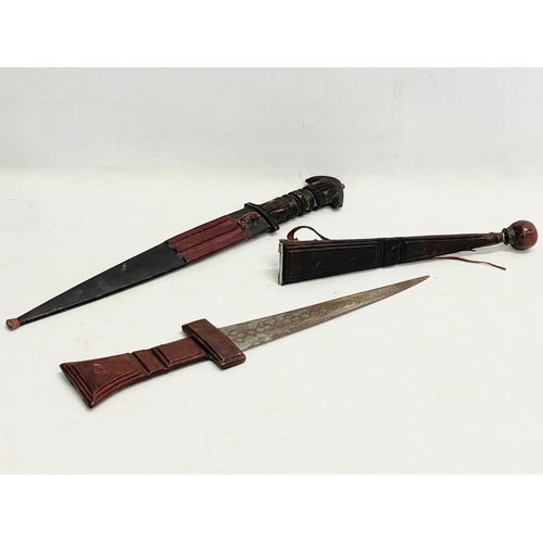 430D - 2 West African leather bound tribal knives. 41cm