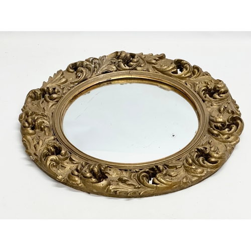 370D - An Early/Mid 20th Century gilt framed convex mirror. 46cm