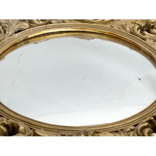 370D - An Early/Mid 20th Century gilt framed convex mirror. 46cm