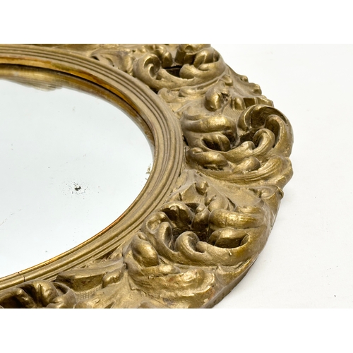 370D - An Early/Mid 20th Century gilt framed convex mirror. 46cm