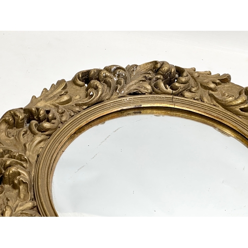 370D - An Early/Mid 20th Century gilt framed convex mirror. 46cm