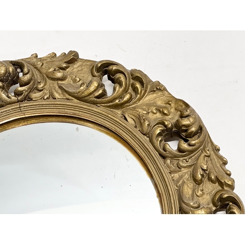 370D - An Early/Mid 20th Century gilt framed convex mirror. 46cm