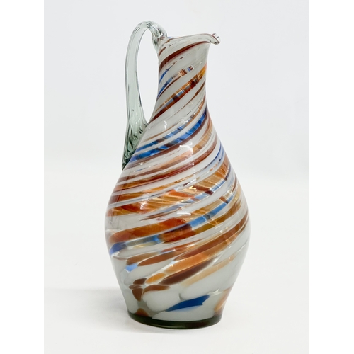 91 - A Mid 20th Century multicoloured hand blown jug. 1960. 22cm