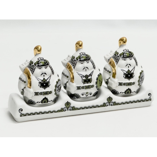 436 - Kapchagay Porcelain Factory. A 4 piece Japanese style spice set. 22cm