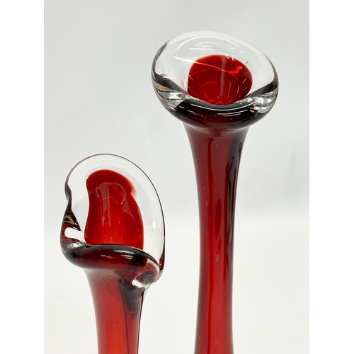 102 - 2 Swedish ruby glass vases with controlled bubble bases. By Aseda. 21cm