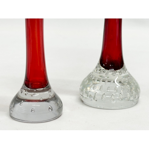 102 - 2 Swedish ruby glass vases with controlled bubble bases. By Aseda. 21cm