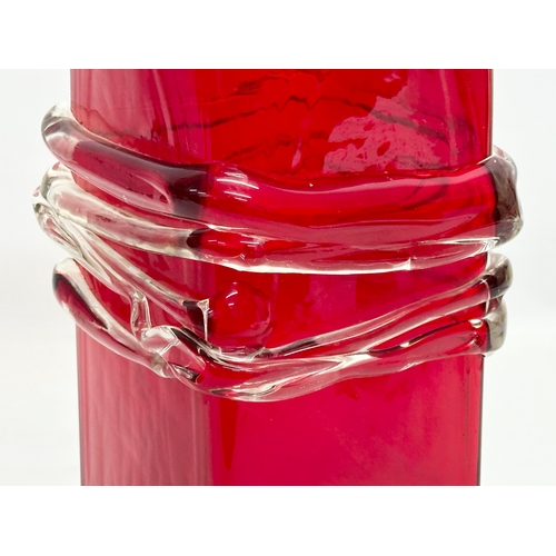 138 - A large Late 20th Century ruby glass vase, bound in a clear glass thread. 13x13x32cm