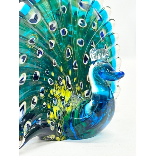 144 - A Late 20th Century art glass peacock. 20x16cm