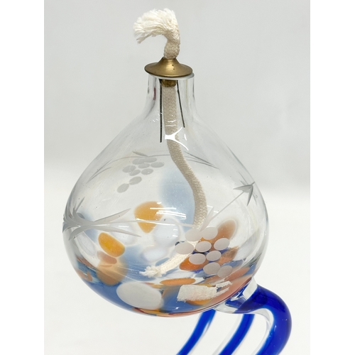 148 - An Irish art glass oil lamp. By Duiske. 26cm