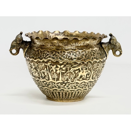 103 - A Late 19th Century Indian brass engraved jardiniere/planter. 25x18.5x14.5cm.