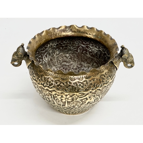 103 - A Late 19th Century Indian brass engraved jardiniere/planter. 25x18.5x14.5cm.