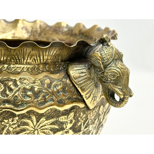 103 - A Late 19th Century Indian brass engraved jardiniere/planter. 25x18.5x14.5cm.