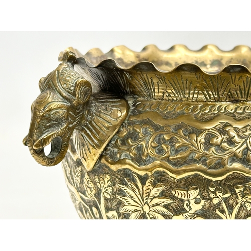 103 - A Late 19th Century Indian brass engraved jardiniere/planter. 25x18.5x14.5cm.