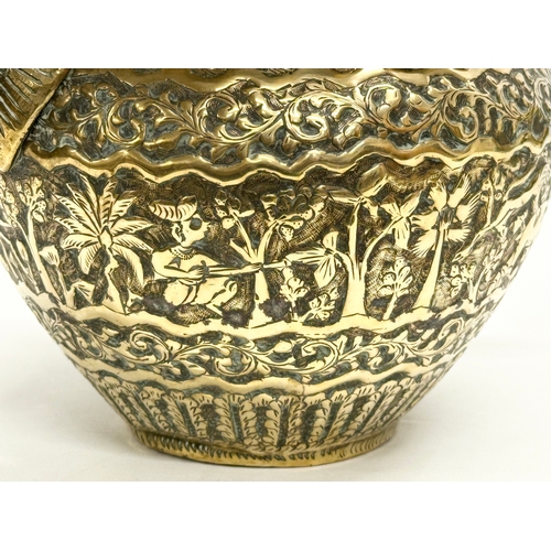 103 - A Late 19th Century Indian brass engraved jardiniere/planter. 25x18.5x14.5cm.