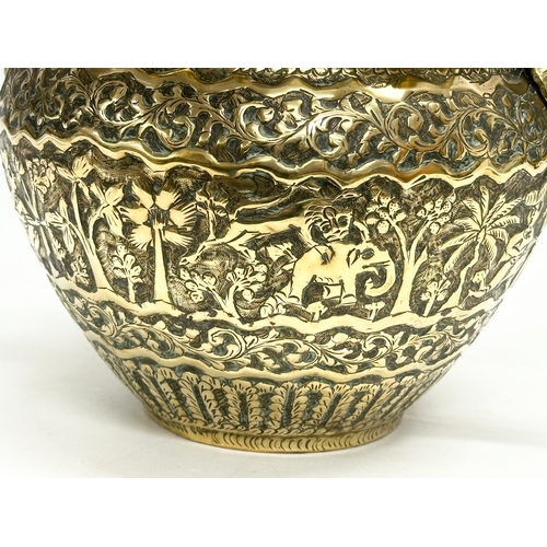 103 - A Late 19th Century Indian brass engraved jardiniere/planter. 25x18.5x14.5cm.