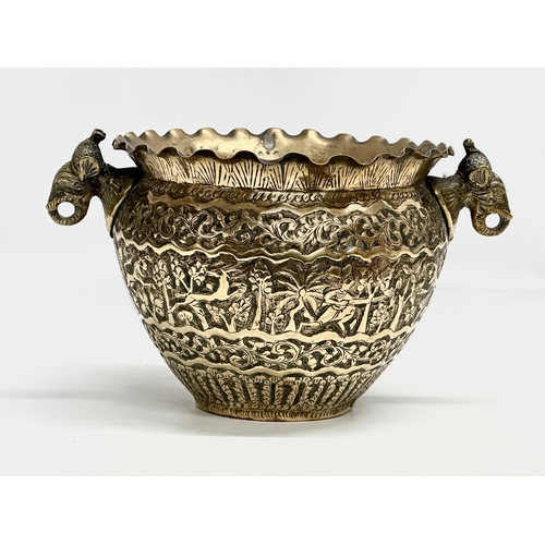 103 - A Late 19th Century Indian brass engraved jardiniere/planter. 25x18.5x14.5cm.