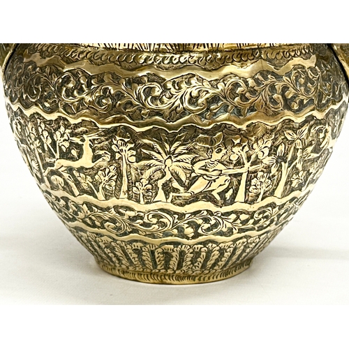 103 - A Late 19th Century Indian brass engraved jardiniere/planter. 25x18.5x14.5cm.