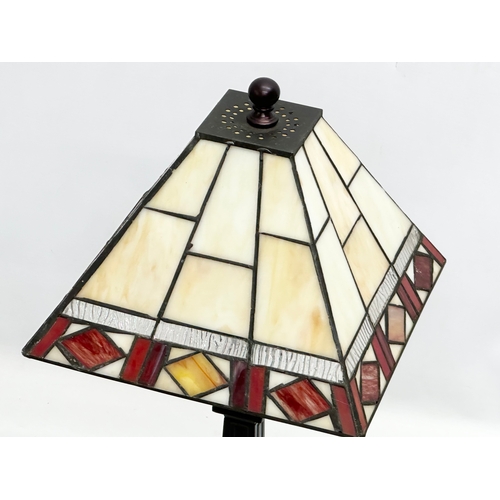 123 - A tall Tiffany style table lamp. 26x26x56cm