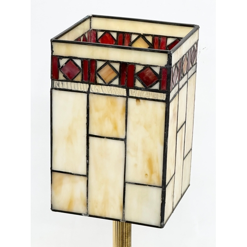 125 - A Tiffany style table lamp, with reeded brass column. 51cm