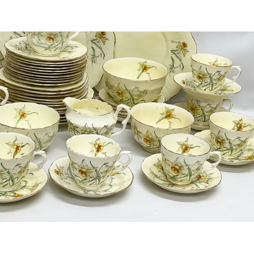 191 - A 64 piece Early 20th Century Crown Staffordshire ‘Daffodil’ tea service. 5 sugar bowls, 3 cream jug... 