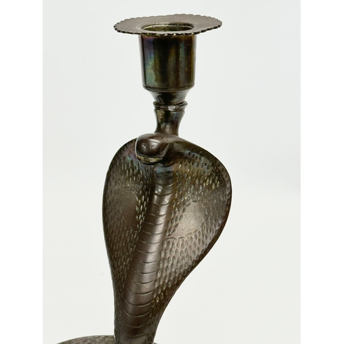 192 - A pair of large Early 20th Century brass cobra candlesticks/candleholders. 18x23x21cm