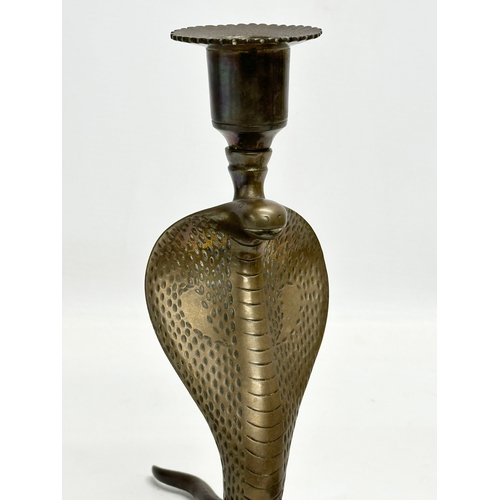 192 - A pair of large Early 20th Century brass cobra candlesticks/candleholders. 18x23x21cm