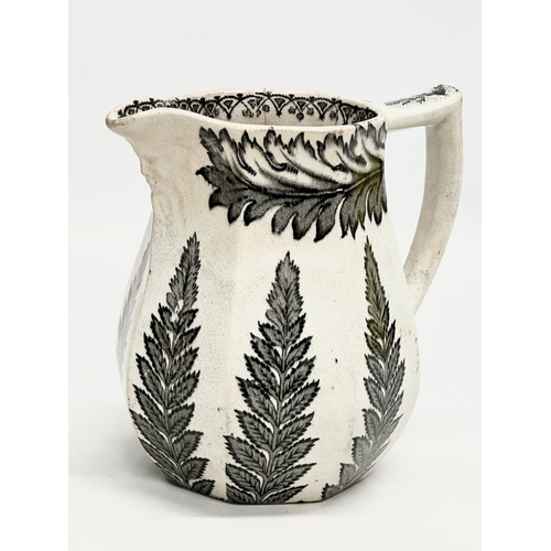 391 - Two 19th Century pottery jug. A John Marshall Bo’ness ‘Fern Leaf’ jug 16x13x16cm. A Mid 19th Century... 