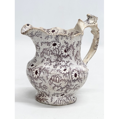 391 - Two 19th Century pottery jug. A John Marshall Bo’ness ‘Fern Leaf’ jug 16x13x16cm. A Mid 19th Century... 