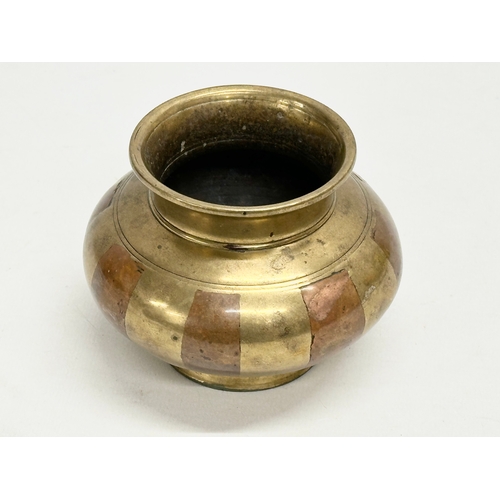 193 - A 19th Century South Indian brass Ganga Jamuna pot. 10x8cm