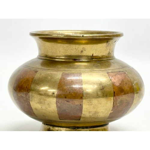 193 - A 19th Century South Indian brass Ganga Jamuna pot. 10x8cm