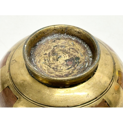 193 - A 19th Century South Indian brass Ganga Jamuna pot. 10x8cm