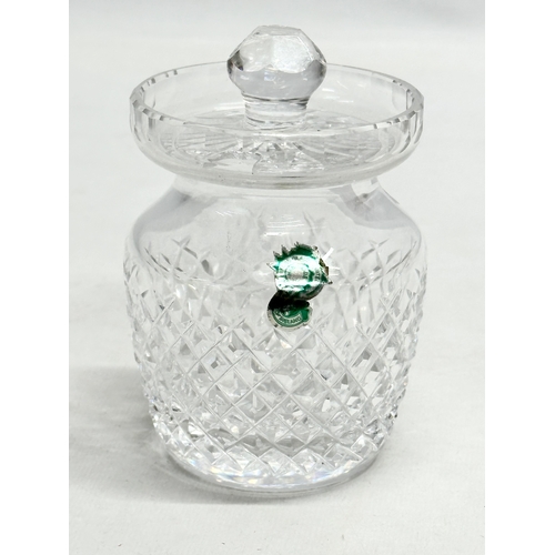 246 - Waterford Crystal. A Waterford Crystal ‘Millennium’ champagne bottle coaster 13x8cm. A Waterford Cry... 