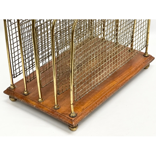 195 - An Edwardian (Edward VII) brass and mahogany paper rack/magazine rack. 41x25x42cm