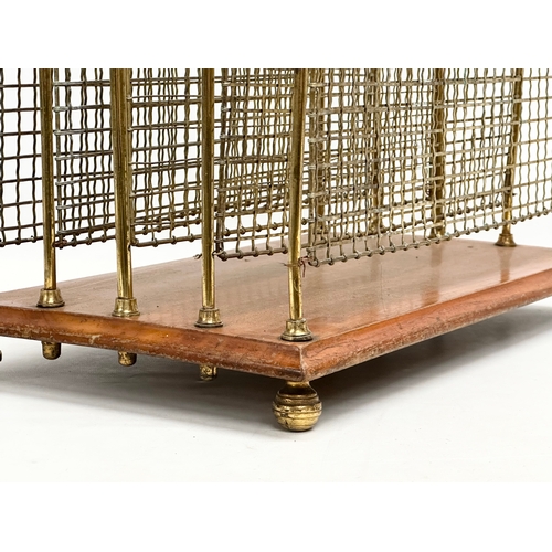 195 - An Edwardian (Edward VII) brass and mahogany paper rack/magazine rack. 41x25x42cm