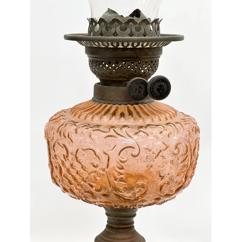 198 - A large 19th Century Victorian double burner oil lamp. With cranberry glass bowl and brass column. 6... 