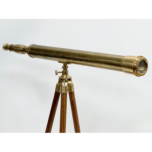 247 - A brass tabletop telescope on stand. 62x53cm