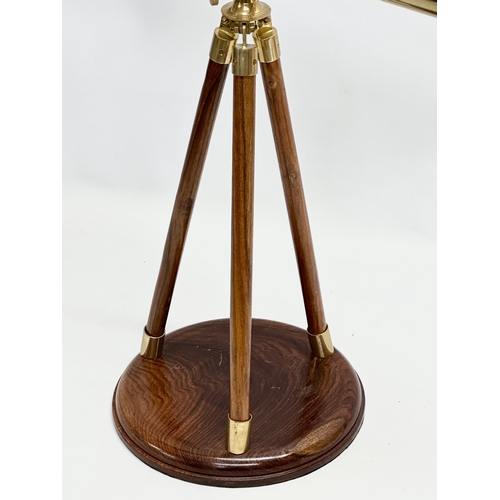 247 - A brass tabletop telescope on stand. 62x53cm