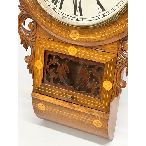 249 - A Late 19th Century inlaid walnut drop dial wall clock. With pendulum. 42x73cm